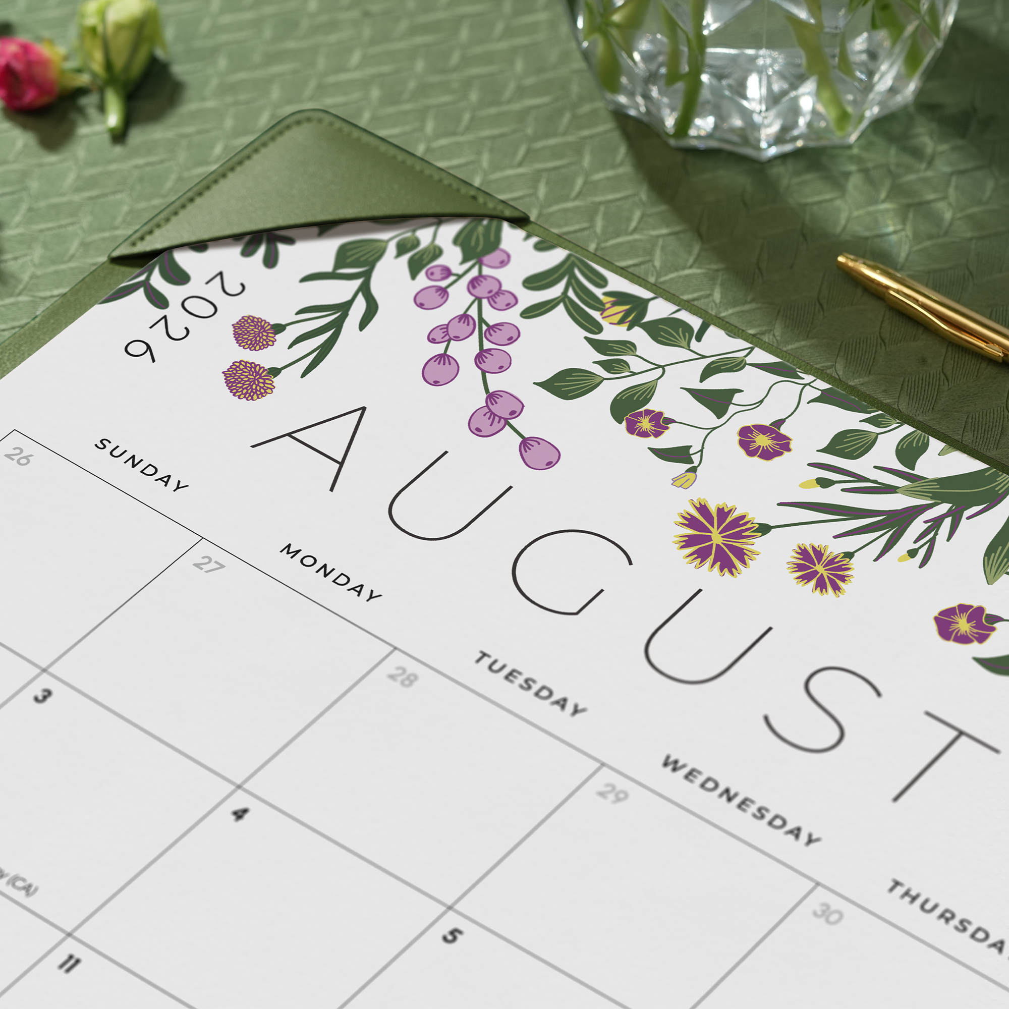 Calendar for August 2026 with floral design on a green surface