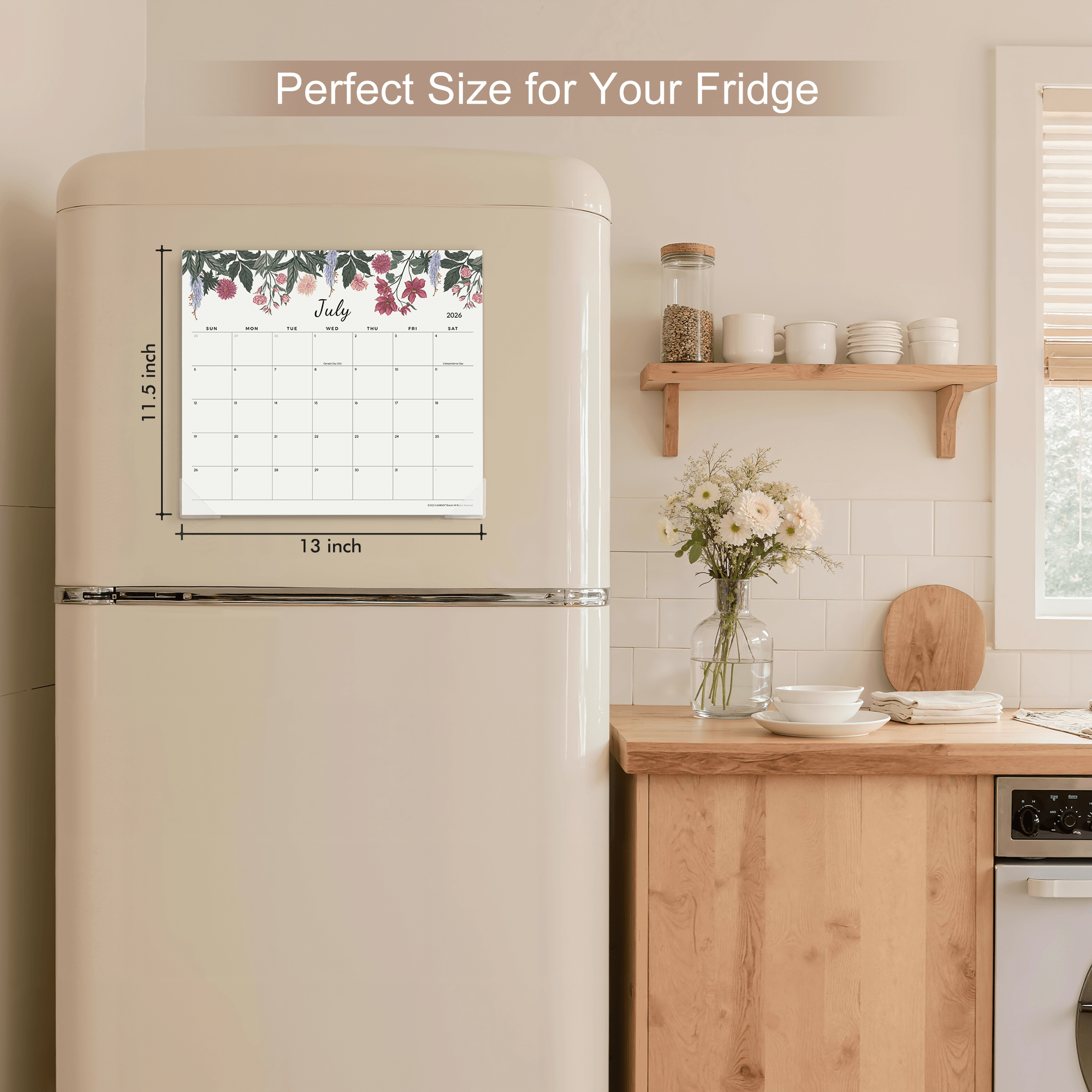 Fridge with a calendar magnet showing July, placed on a kitchen counter.