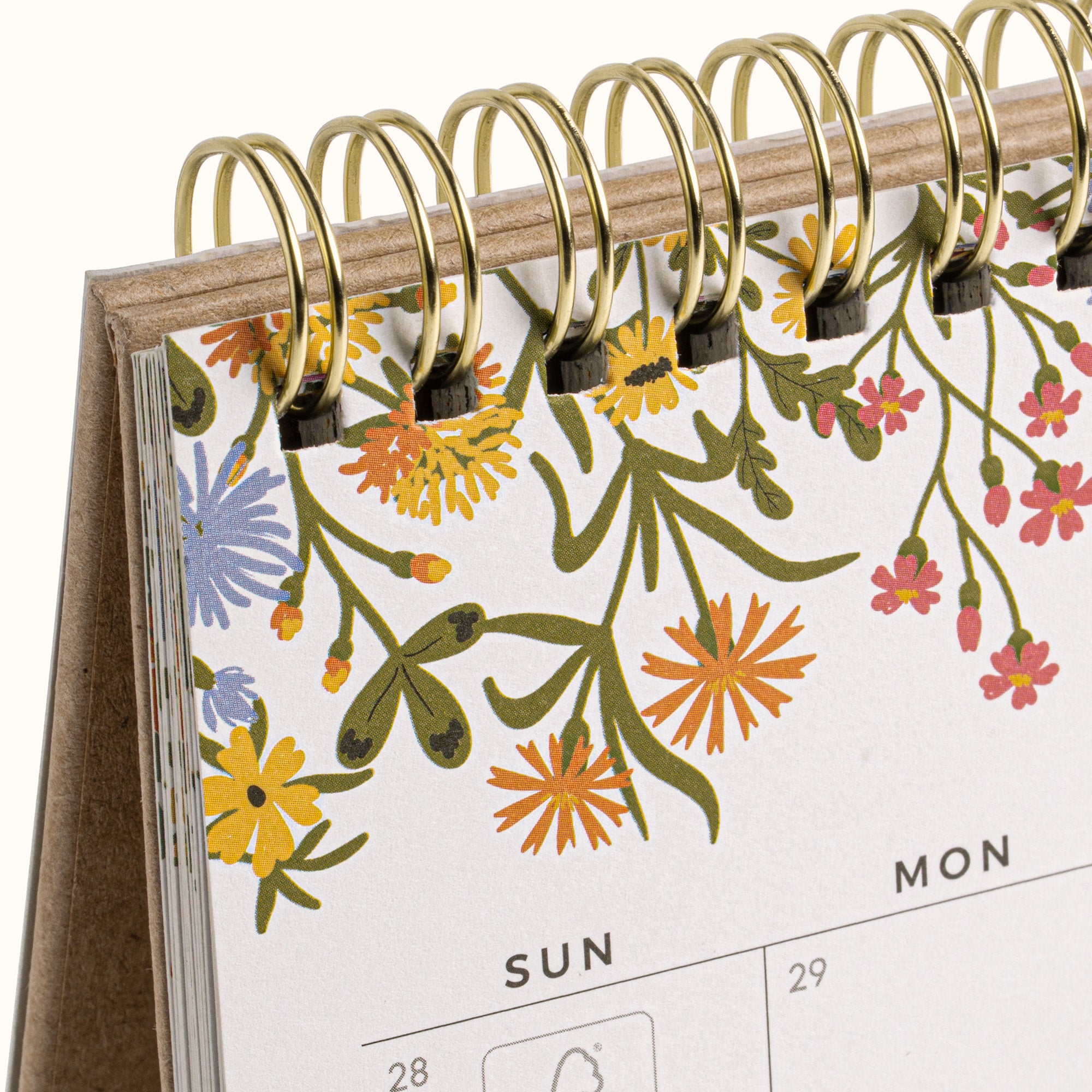 Floral-patterned desk calendar with gold ring binding