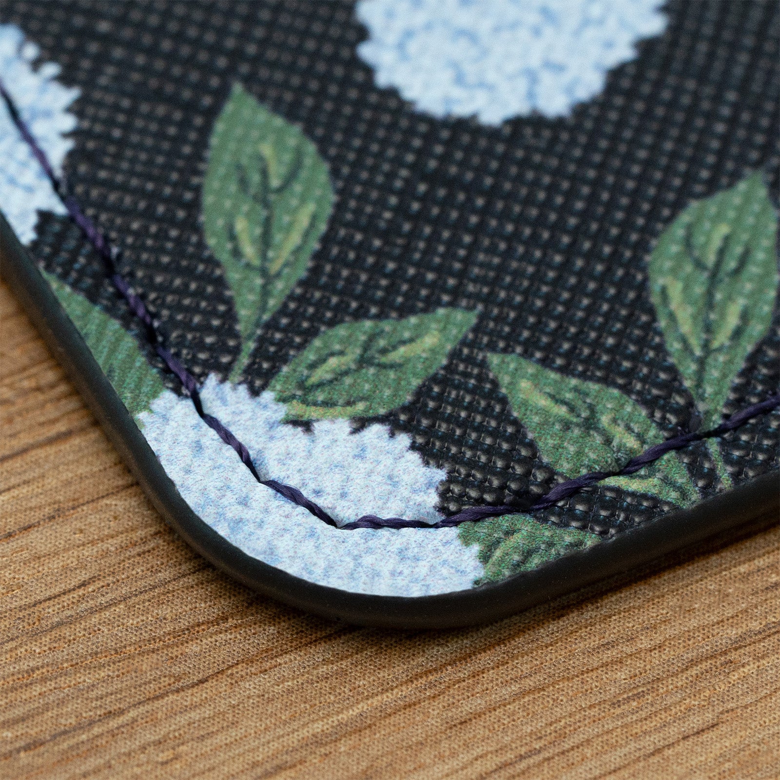 Close-up of a fabric with floral pattern on a wooden surface