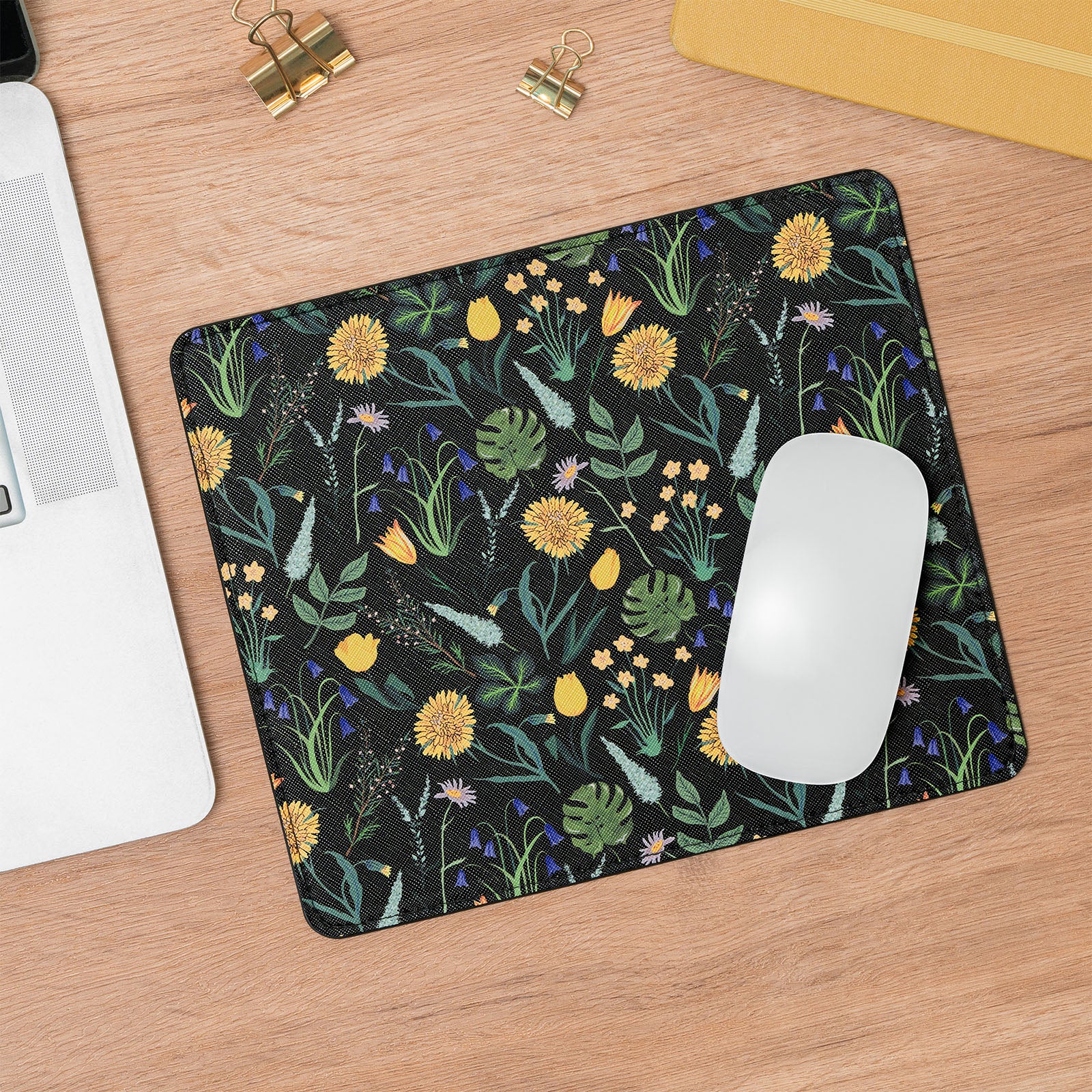Mouse pad with floral design on a wooden desk