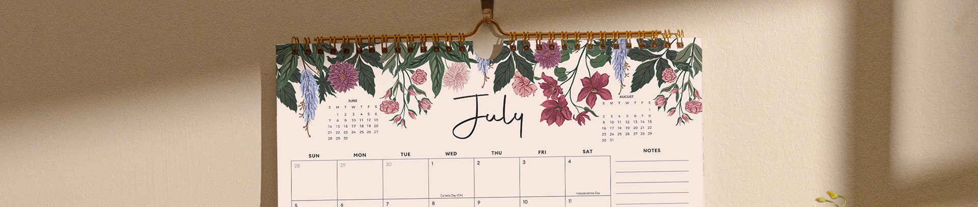 Floral-themed calendar hanging on a wall