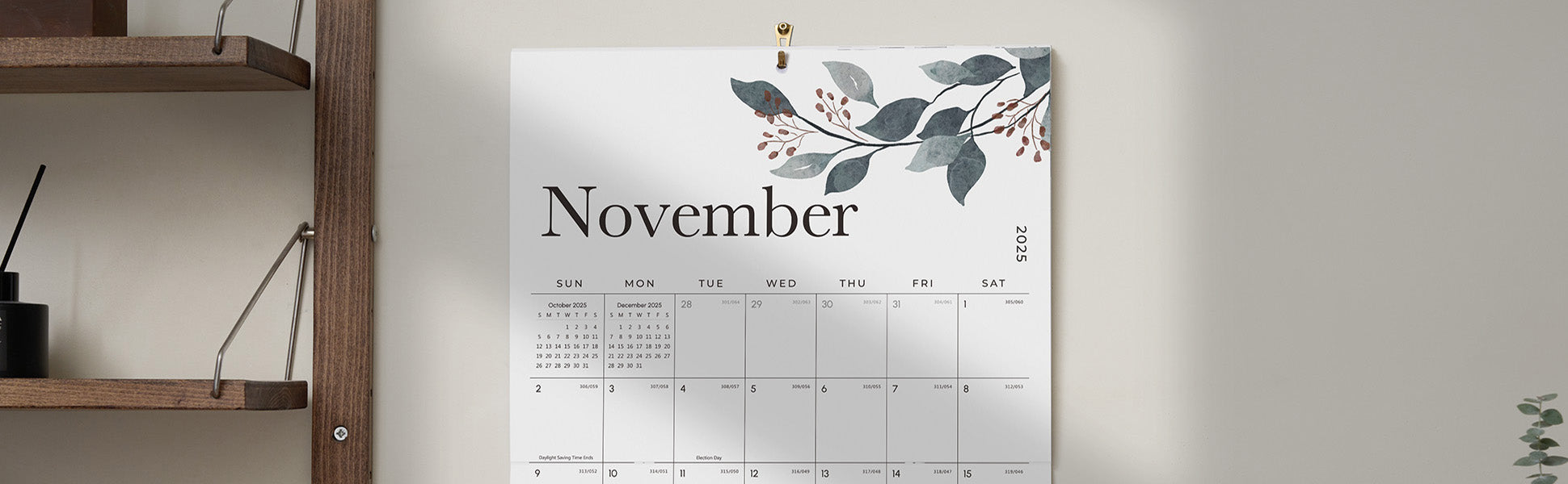 Calendar for November with a floral design on a gray wall.