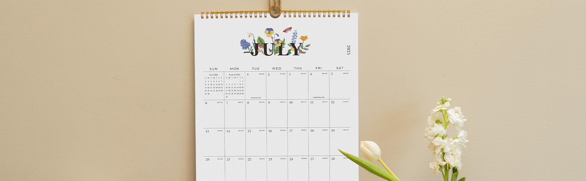 Calendar for July on a beige background with a flower