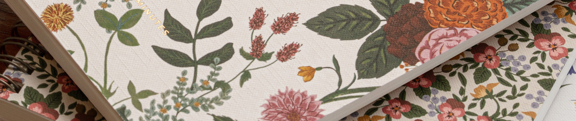 Floral and leaf patterned paper with a focus on green, pink, and orange colors.