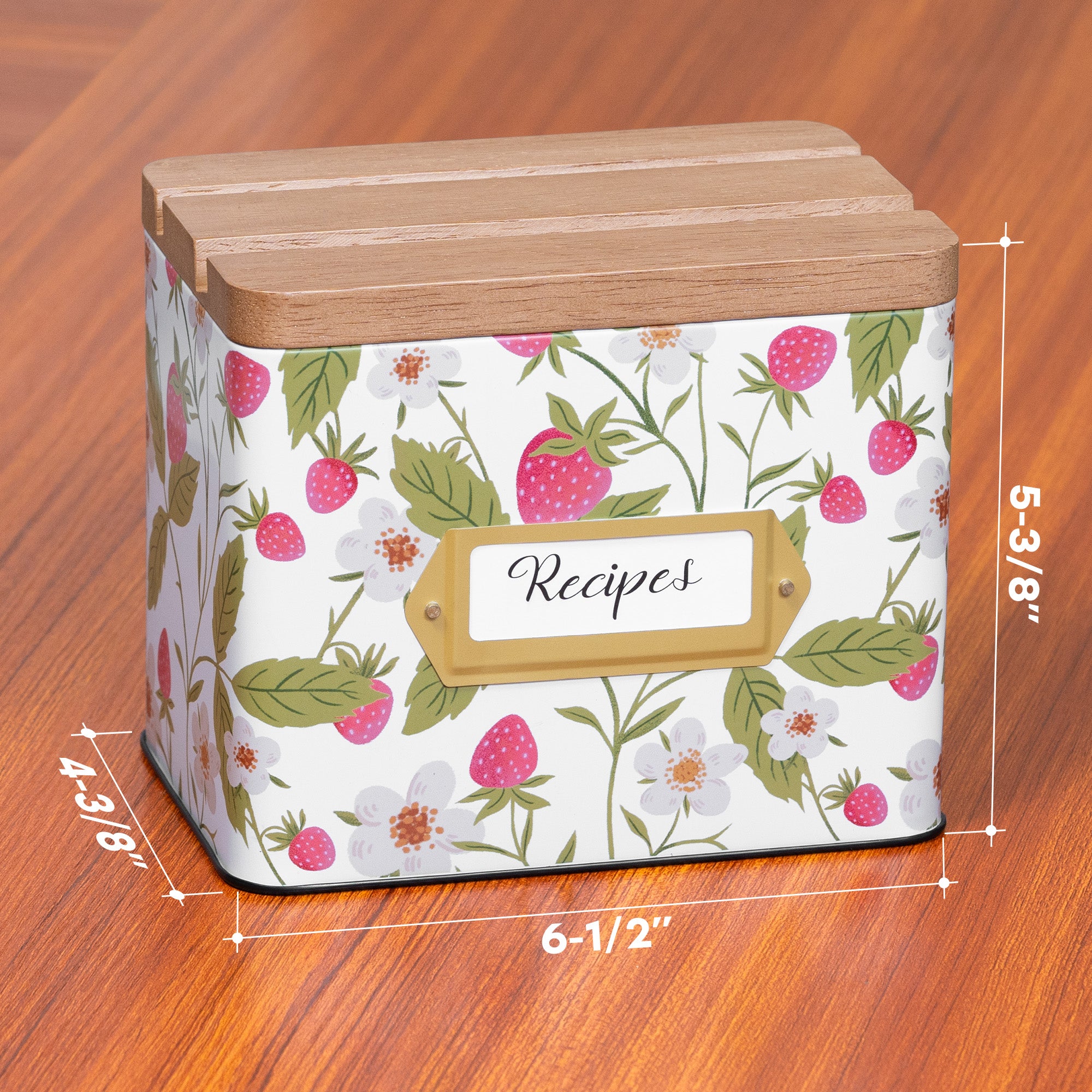 Decorative recipe box with floral design and wooden lid on a wooden surface, with measurements indicated.